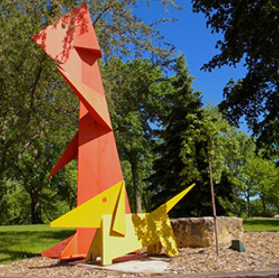 The Anidonts aluminum sculpture done by Luis Arata depicting an orange boy and his yellow dog. It is located at the entrance to the Nature Place on La Crosse Street.