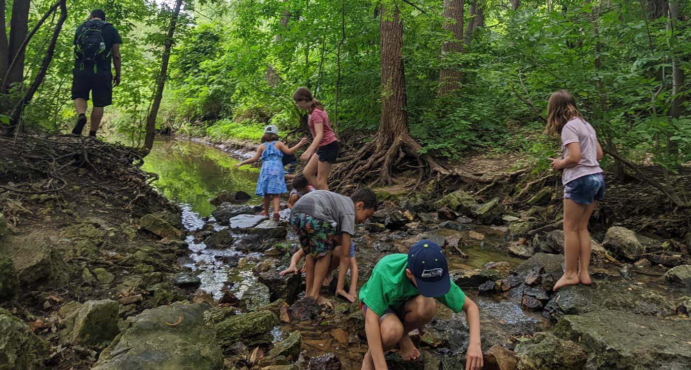 kids exploring a creek