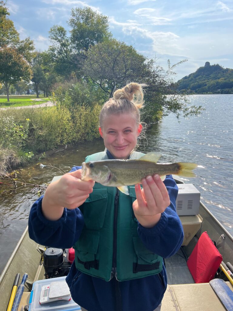 Photo of Emma Ehlers holding a fish.