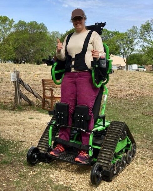 person using the Nature Place accessible mobile trail vehicle