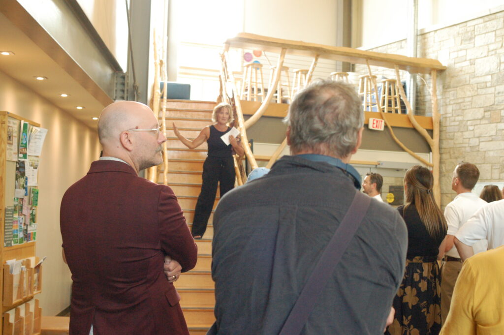 Mary Freybler, Director of Development thanks all the supporter for attending the solar array installation ribbon cutting event
