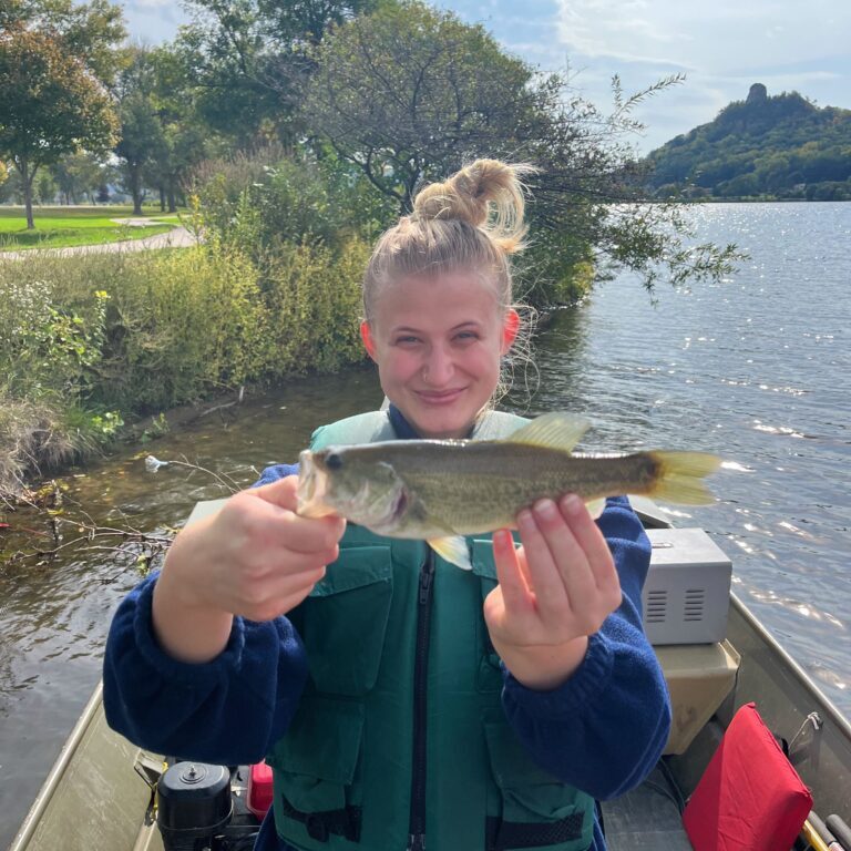 Photo of Emma Ehlers holding a fish.